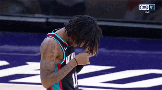 Ja Morant Adjusts Hair for Memphis Grizzlies