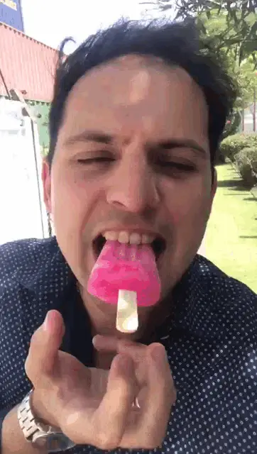 Marquitos Enjoying a Pink Paleta