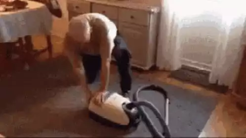 Man Struggles with Vacuum Cleaner Meme
