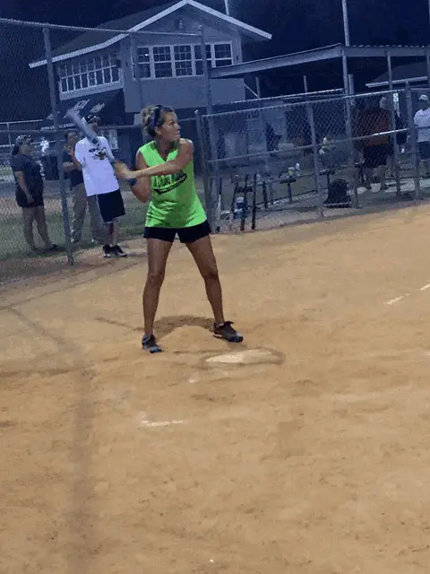 Softball Player Swings for a Home Run