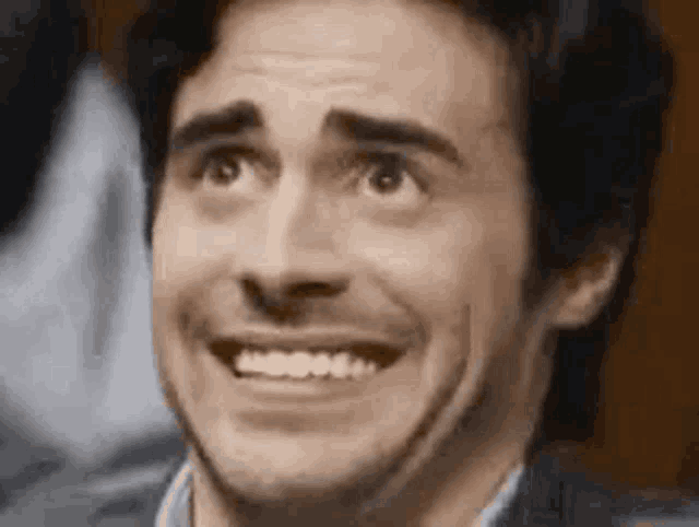 Anxious Man's Awkward Smile