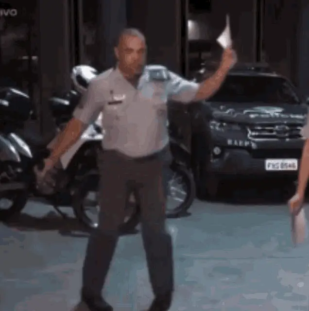 Capitao Duarte Dancing in Police Uniform