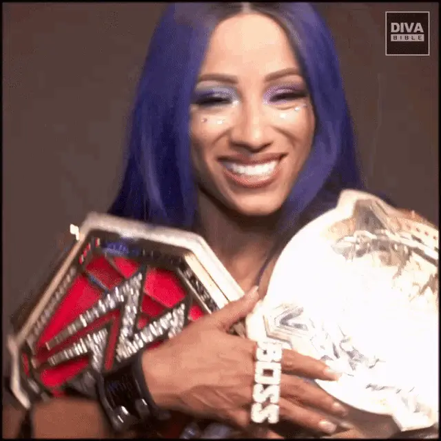 Sasha Banks Laughing with WWE Titles