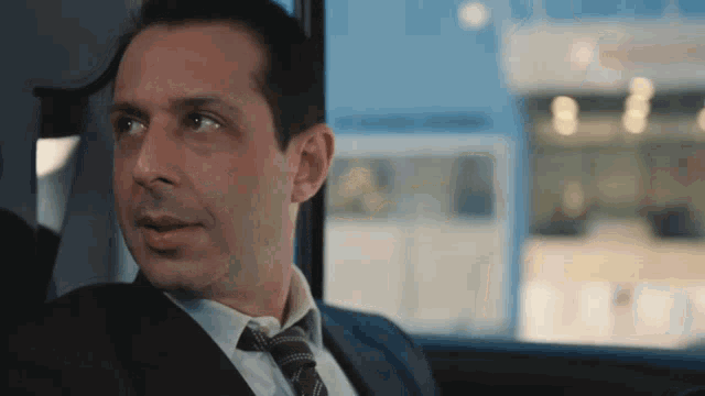 Succession's Kendall Roy Smiling in Car