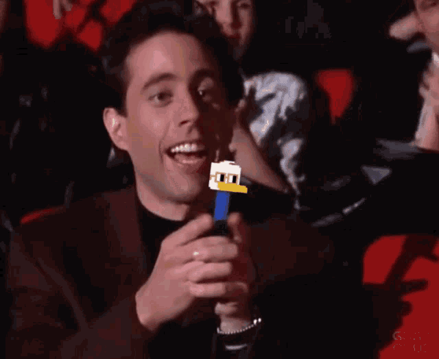 Jerry Seinfeld with Nounish Pez Dispenser