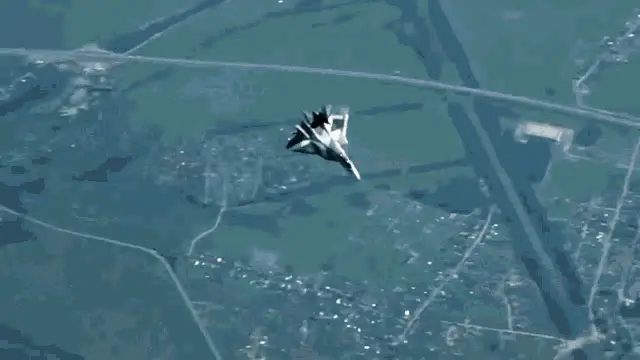 Sukhoi Jet Flying Through Clouds
