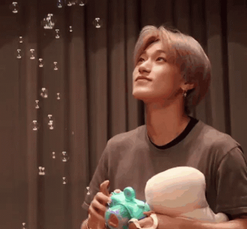 Choi San Playing with Bubbles