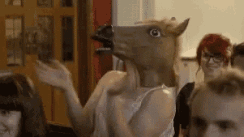 Person in Horse Mask Gives Thumbs Up