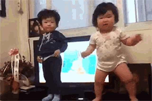 Two Adorable Babies Dancing
