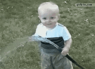 Funny Baby Gets Sprayed by Water Hose