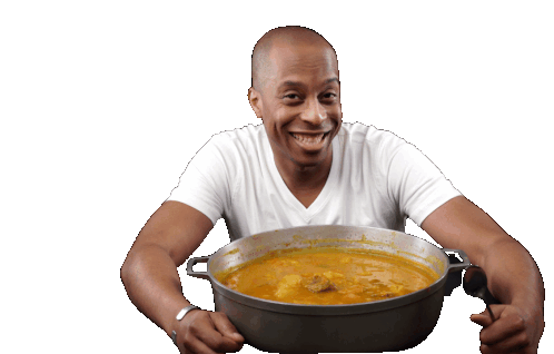 Man Enjoying Haitian Soup Joumou