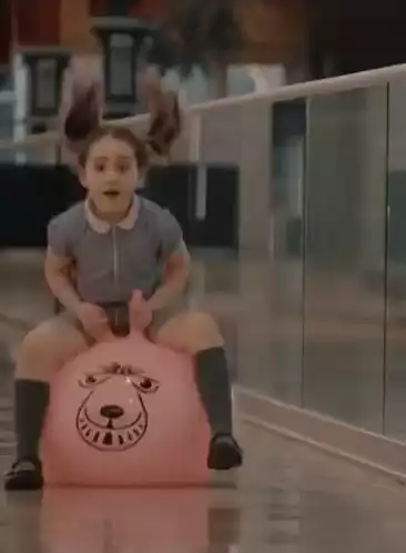 Girl Bouncing on Hopper Ball with Jamie Lawson