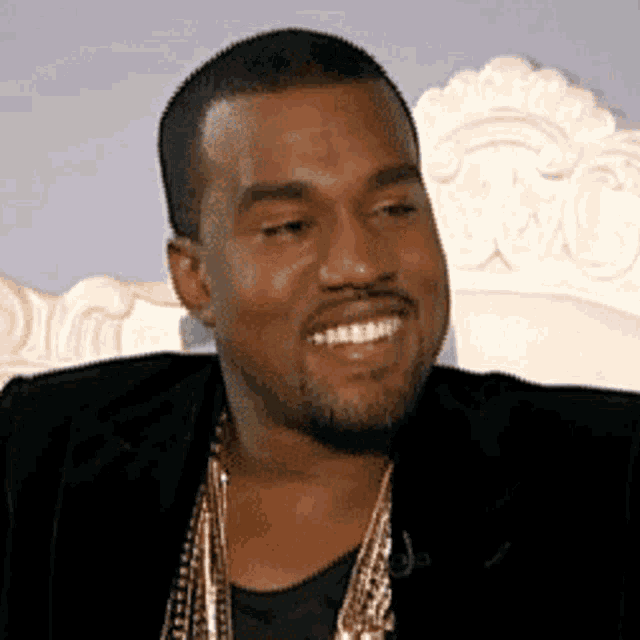 Kanye West Smiling with Gold Chains