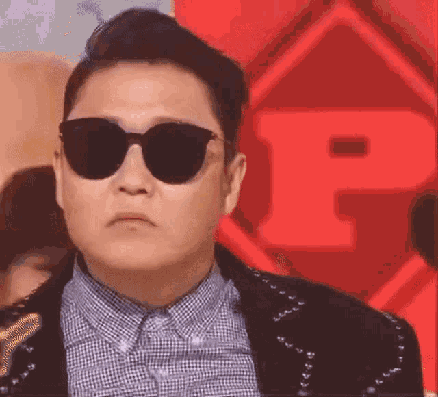 Psy's Iconic Finger Heart Gesture