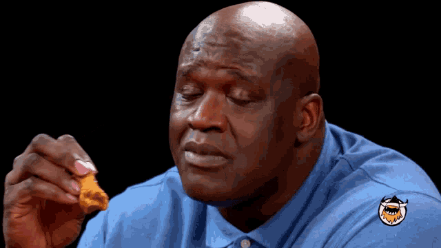 Shaquille O'Neal Tastes Chicken Wing