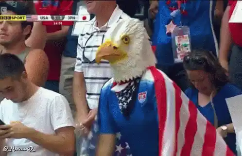 https://klipy.com/gifs/america-patriotic-1 ## USA Fan in Eagle Mask at Sports Match …