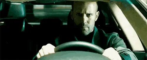 Jason Statham Driving Intensely