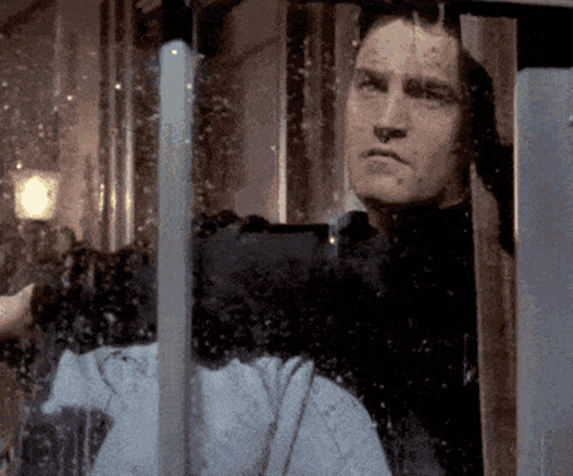 Chandler Bing Looks Sad and Lonely in the Rain