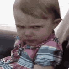 Baby in Car Seat Makes Funny, Skeptical Face