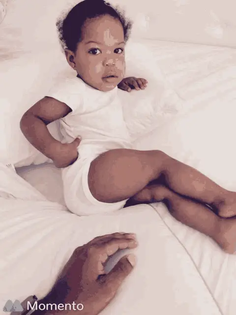 Michaelray Baby Relaxing on Bed