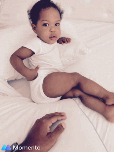 Michaelray Baby Relaxing on Bed