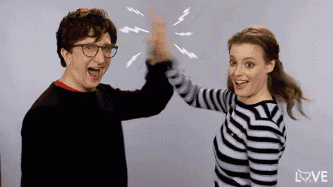 Gillian Jacobs and Paul Rust High Five