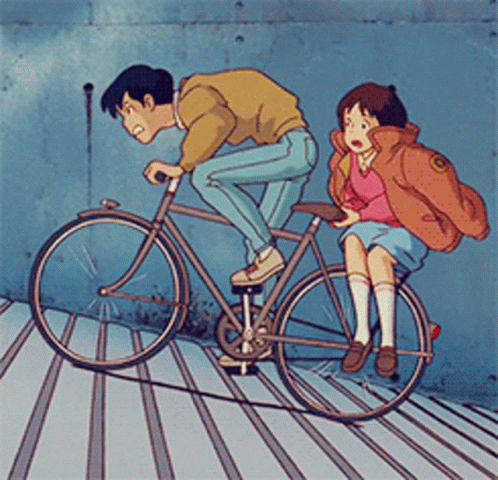 Couple's Uphill Bicycle Teamwork