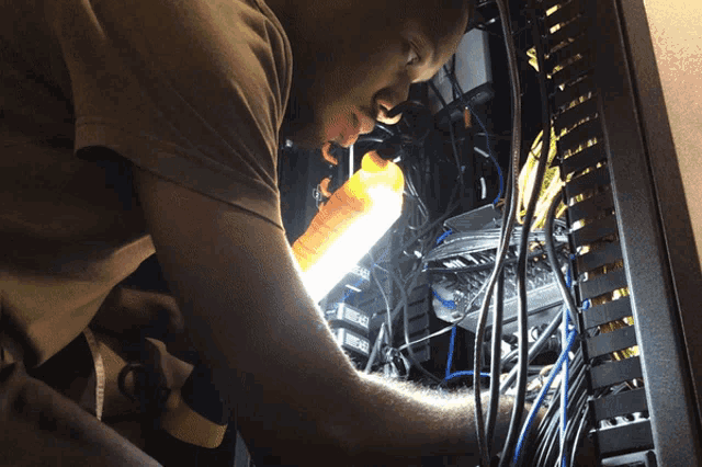 Engineer Fixing Server Rack