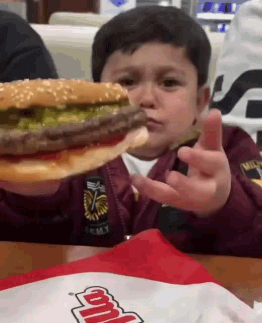 Kid Eating Burgir Meme