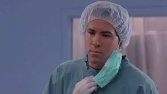 But Why? Man in Surgical Gown