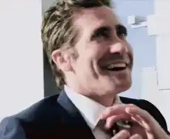 Jake Gyllenhaal Adjusting Tie