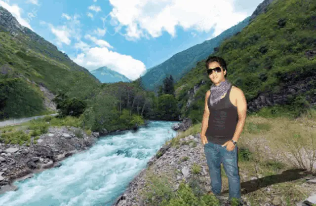 Anujit Posing by the Mountain River