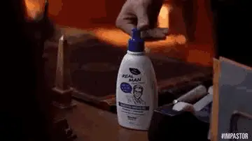 Hand Pressing Real Man Lotion Bottle