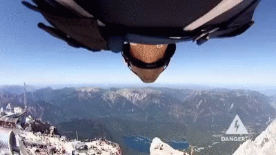 Wingsuit Base Jump and Parachute Deployment