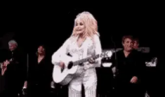 Dolly Parton Playing Guitar on Stage – free GIF download | meme platform | memes GIF