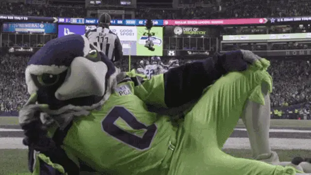 Seattle Seahawks Mascot Blitz on Football Field – free memes GIF download | meme platform