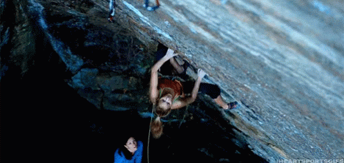 Woman Scaling Mountain Upside Down