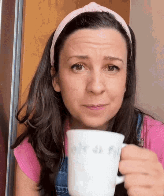 Ms Rachel Sips from Her Mug