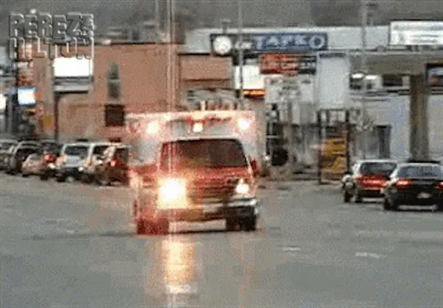 Ambulance Driving Down Street