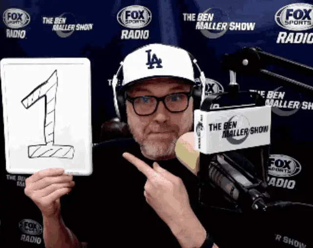 Ben Maller Holds Up Number 1 Sign