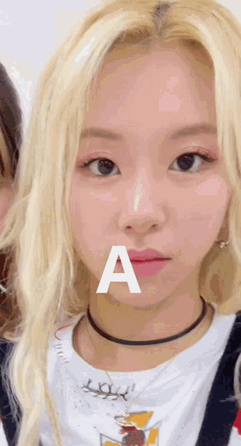 No Me Importa - Woman with 'A' on Face