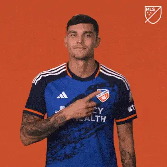 Brandon Vazquez Pointing to His FC Cincinnati Badge