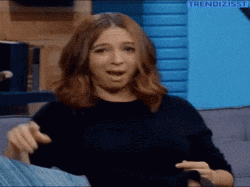 Woman Winks and Forms Heart Gesture