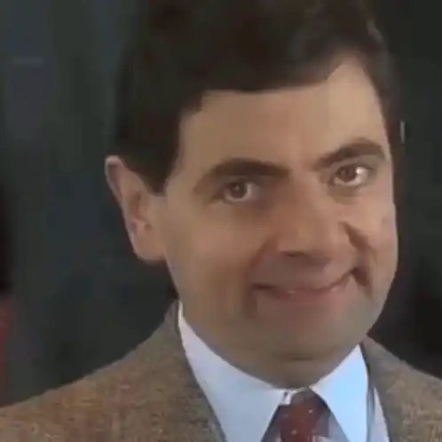 Rowan Atkinson as Mr. Bean Making a Funny Face