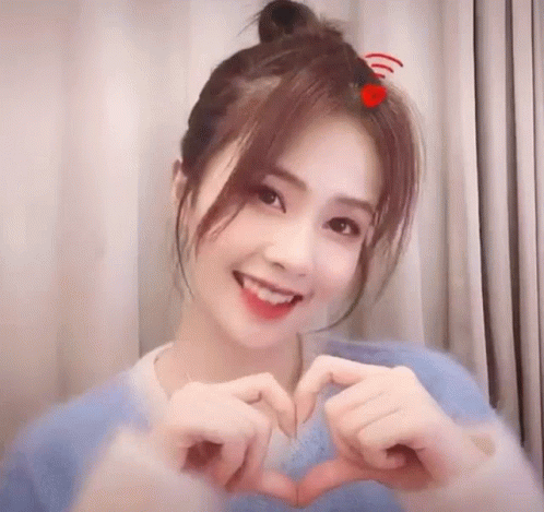 Bailu Bachloc Makes a Heart Gesture