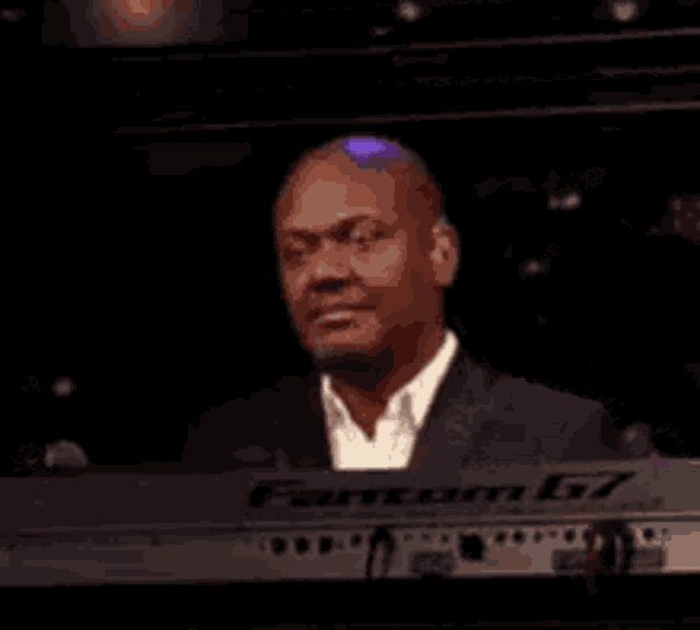 Man Chuckling at Keyboard