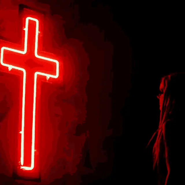Woman by Red Neon Cross