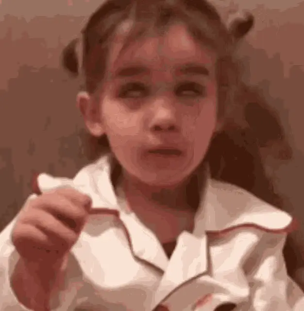 Little Girl Makes Funny Face and Waves
