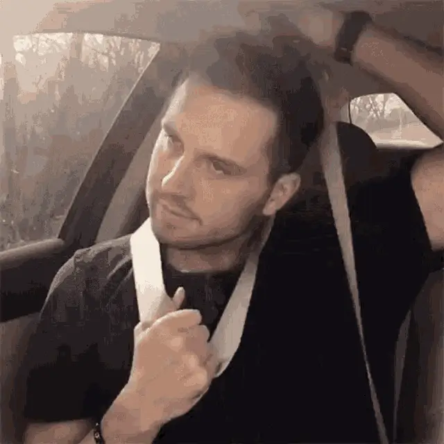 Man's Playful Seatbelt 'KMS' Moment